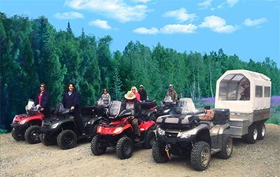Guests ready to head out on all terrain vehicles and covered wagon