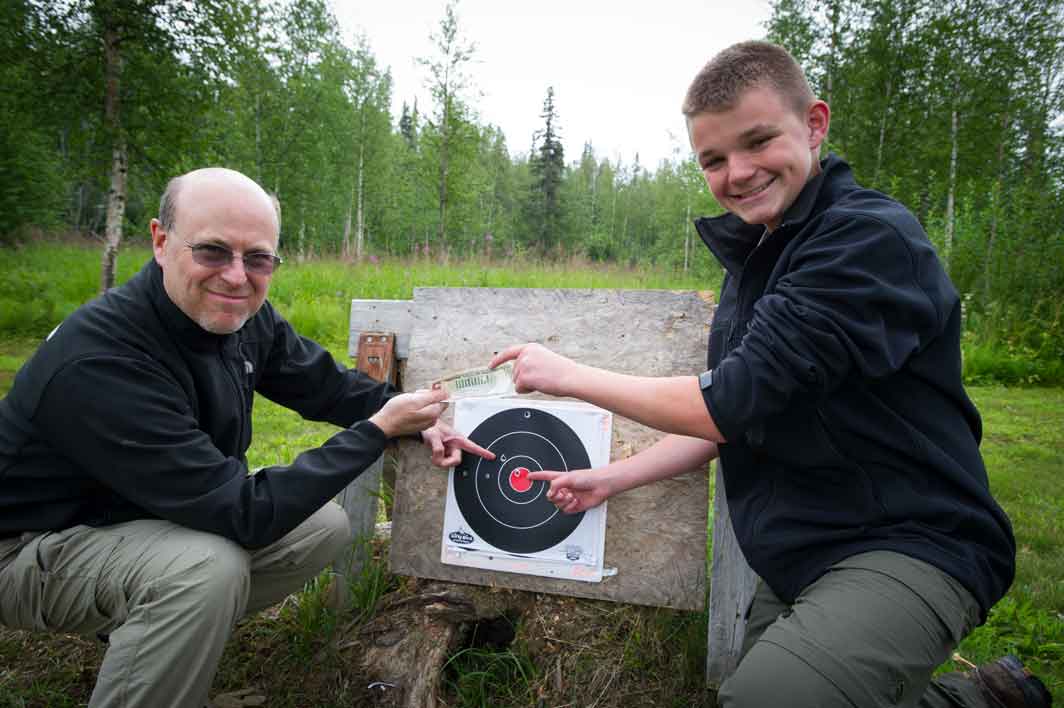Celebrating a bullseye at the homestead target range